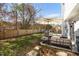 Backyard showcasing an umbrella, an outdoor grill, and an outdoor seating area at 11 Marsh Landing Ct, Durham, NC 27703