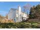 The backyard features a white house, fenced-in yard, patio, grill, and mature landscaping at 11 Marsh Landing Ct, Durham, NC 27703