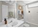 Neutral bathroom with white vanity, framed mirror, tub and shower at 11 Marsh Landing Ct, Durham, NC 27703