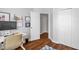 Bedroom with wood floors and view to a hallway with closets and other bedrooms at 11 Marsh Landing Ct, Durham, NC 27703