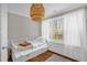 Charming bedroom features a trundle bed, wood floors, and lots of natural light at 11 Marsh Landing Ct, Durham, NC 27703