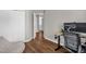 Neutral bedroom with wood flooring, closet, desk, and view to a hallway at 11 Marsh Landing Ct, Durham, NC 27703