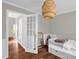 Bedroom view showcasing the white French doors and a glimpse into the hallway at 11 Marsh Landing Ct, Durham, NC 27703
