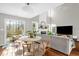 An open concept living space combines dining area and living room with ample natural light at 11 Marsh Landing Ct, Durham, NC 27703