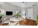 Dining area featuring a round table, a stainless steel dishwasher, and hardwood floors at 11 Marsh Landing Ct, Durham, NC 27703