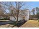 A charming two-story home with a well-manicured lawn, two-car garage and a red front door at 11 Marsh Landing Ct, Durham, NC 27703