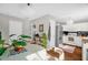 Bright kitchen and dining area with stainless steel appliances, white cabinets, and hardwood floors at 11 Marsh Landing Ct, Durham, NC 27703
