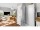 Stylish kitchen with stainless steel refrigerator and view into the bright dining and living area at 11 Marsh Landing Ct, Durham, NC 27703