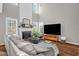 Bright living room with a fireplace, television and hardwood flooring at 11 Marsh Landing Ct, Durham, NC 27703