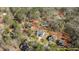 Stunning aerial view of a home surrounded by trees, highlighting its natural privacy and serene setting at 112 Rawhide Dr, Louisburg, NC 27549