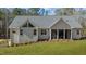 Rear exterior view of a home featuring siding, and a screened in porch at 112 Rawhide Dr, Louisburg, NC 27549