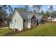 Rear exterior view of a home featuring siding, and a screened in porch at 112 Rawhide Dr, Louisburg, NC 27549