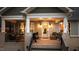 Inviting front porch with cozy seating, wreath on the door, and brick accents at 112 Rawhide Dr, Louisburg, NC 27549