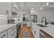 Modern kitchen with a center island, stainless steel appliances, and ample storage space at 112 Rawhide Dr, Louisburg, NC 27549