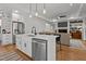 Open concept kitchen with stainless steel appliances, an island, and adjacent living space at 112 Rawhide Dr, Louisburg, NC 27549