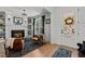 Warm living room featuring a fireplace, hardwood floors, and comfortable seating at 112 Rawhide Dr, Louisburg, NC 27549
