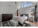 Bright main bedroom with a vaulted ceiling, large windows, a ceiling fan, and a decorative rug at 112 Rawhide Dr, Louisburg, NC 27549