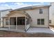 The home has a rear screened in porch and stone patio at 1135 Rosepine Dr, Cary, NC 27519