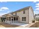 The home features a rear screened in porch and stone patio at 1135 Rosepine Dr, Cary, NC 27519