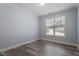 Clean bedroom with neutral walls, window at 1135 Rosepine Dr, Cary, NC 27519