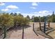 Scenic greenway access featuring a brick path, wooden fence, and lush surroundings for outdoor enjoyment at 1135 Rosepine Dr, Cary, NC 27519