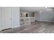 Open hallway with wood-look floors, doors at 1135 Rosepine Dr, Cary, NC 27519
