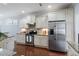 Kitchen with granite counters, stainless steel appliances, and ample storage at 1135 Rosepine Dr, Cary, NC 27519
