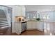 Kitchen with granite countertops, stainless steel appliances, and eat-in bar at 1135 Rosepine Dr, Cary, NC 27519