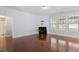 Spacious living room with fireplace and large windows, offering plenty of natural light at 1135 Rosepine Dr, Cary, NC 27519