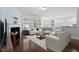 Cozy living room with fireplace, comfortable seating, and open to the dining area at 1135 Rosepine Dr, Cary, NC 27519