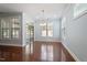 Bright living room with hardwood floors, chandelier, and natural light at 1135 Rosepine Dr, Cary, NC 27519