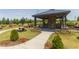 Stone picnic shelter with fireplace and grilling stations in the community park at 1135 Rosepine Dr, Cary, NC 27519