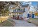 Charming two-story building with white siding, green shutters, and appealing business frontage at 120 Lake Orange Rd, Hillsborough, NC 27278