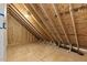 Unfinished attic space displaying the home's rafter and truss construction, ready for insulation at 1403 Antioch Church Rd, Timberlake, NC 27583