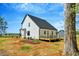 Spacious backyard with a wooden deck, ideal for relaxing or entertaining guests at 1403 Antioch Church Rd, Timberlake, NC 27583