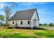 A sprawling backyard featuring a wooden deck perfect for outdoor entertaining at 1403 Antioch Church Rd, Timberlake, NC 27583
