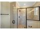 Modern bathroom features a tiled shower with glass door and sleek, black hardware at 1403 Antioch Church Rd, Timberlake, NC 27583
