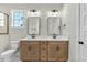 Bathroom features double vanity with modern fixtures, providing style and functionality at 1403 Antioch Church Rd, Timberlake, NC 27583