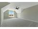Spacious bedroom with unique built-in shelving and plush carpeting provides comfort and style at 1403 Antioch Church Rd, Timberlake, NC 27583