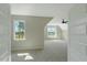 Bright bedroom featuring plush carpet, a ceiling fan, and views from the built-in shelving at 1403 Antioch Church Rd, Timberlake, NC 27583