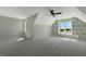 Bright bedroom featuring a ceiling fan and unique built-in shelving and large windows at 1403 Antioch Church Rd, Timberlake, NC 27583