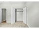 Bright bedroom with an open closet featuring an open doorway, neutral walls, and new carpet at 1403 Antioch Church Rd, Timberlake, NC 27583