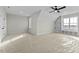 Large bonus room with ceiling fan, built-ins, and multiple windows at 1403 Antioch Church Rd, Timberlake, NC 27583