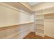 Walk-in closet with custom shelving and ample storage space, providing organization at 1403 Antioch Church Rd, Timberlake, NC 27583