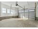 Spacious two car garage with bright natural light and a sturdy concrete floor at 1403 Antioch Church Rd, Timberlake, NC 27583