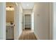 Inviting hallway featuring luxury vinyl plank flooring, access to the bathroom, and a linen closet at 1403 Antioch Church Rd, Timberlake, NC 27583