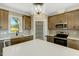 Kitchen featuring an island, stainless steel appliances, walk-in pantry, and ample cabinet space at 1403 Antioch Church Rd, Timberlake, NC 27583