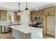 Kitchen features quartz island, stainless appliances, and pendant lighting at 1403 Antioch Church Rd, Timberlake, NC 27583