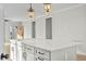 Kitchen island featuring white countertop and modern pendant lighting at 1403 Antioch Church Rd, Timberlake, NC 27583