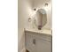 Stylish powder room featuring shiplap accent wall, modern vanity, and decorative lighting at 1403 Antioch Church Rd, Timberlake, NC 27583